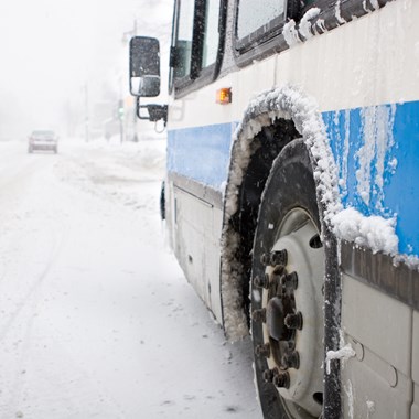 Side of bus in bad snow weather conditions